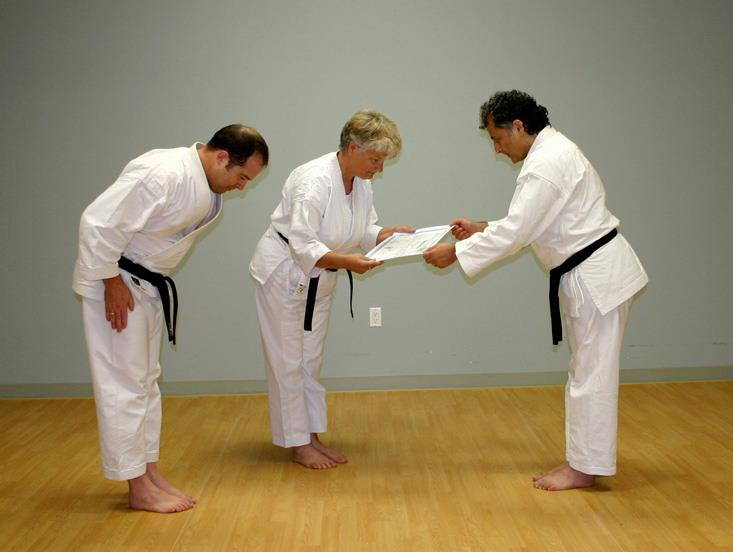 Symbolically receiving the Judo Balck Belt Certificate